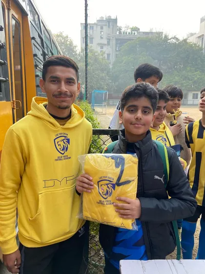 A young player receives a new academy jersey as his prize. We love to see our players wear the DYFA crest with pride.