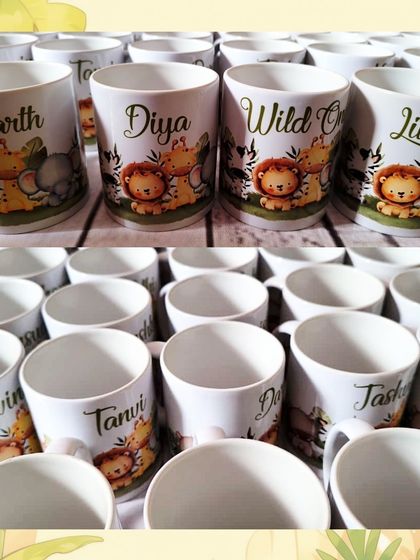 A closer look at the personalized jungle-themed mugs. I can add each child's name alongside the cute animal graphics, making it a cherished keepsake from the party.