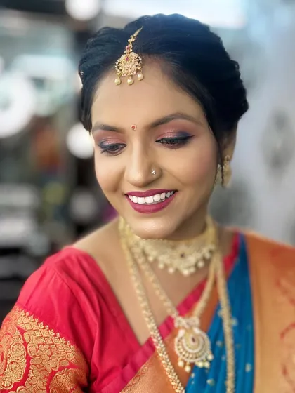 A soft and happy expression from the model, showing the confidence that comes with a well-executed makeup look.