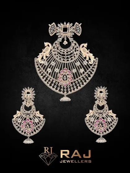 A beautiful pendant and earring set mounting featuring peacock motifs and delicate pink stone settings. This base is perfect for creating a piece that is both traditional and feminine.