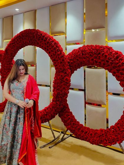 Posing with the giant floral rings that formed the stage backdrop. A perfect photo op.