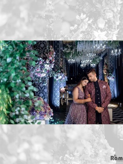 A quiet, romantic moment captured as the couple stands together amidst lush greenery and beautiful decor at their engagement venue.