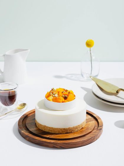 A full view of our Cold Mango Cheesecake, a minimalist and elegant dessert.