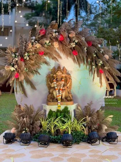 The Ganesha installation, a perfect blend of traditional blessings and modern rustic decor with pampas grass and a soft-lit backdrop.