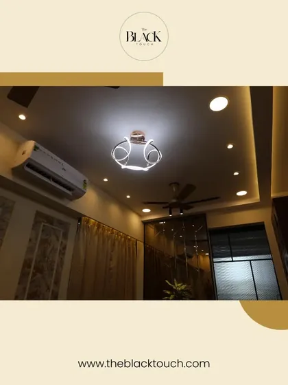 A look at the ceiling design in one of our projects, featuring a modern chandelier and cove lighting. Thoughtful lighting design is crucial for creating ambiance.