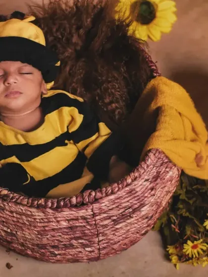 Even sleepy newborns can be little honey bees. This peaceful shot is incredibly sweet.