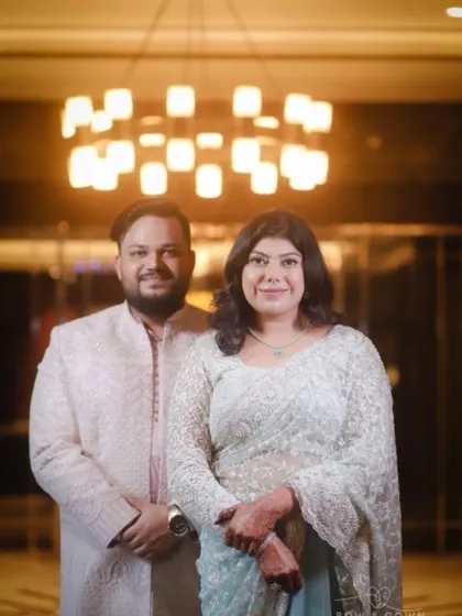 A lovely portrait of the couple looking directly at the camera. Their coordinated outfits and the elegant backdrop make this a perfect photo from their Roka ceremony.