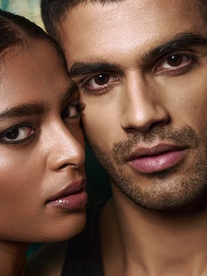 A direct and engaging couple's portrait. Both models look straight into the camera, creating a powerful and confident image that feels both intimate and strong.