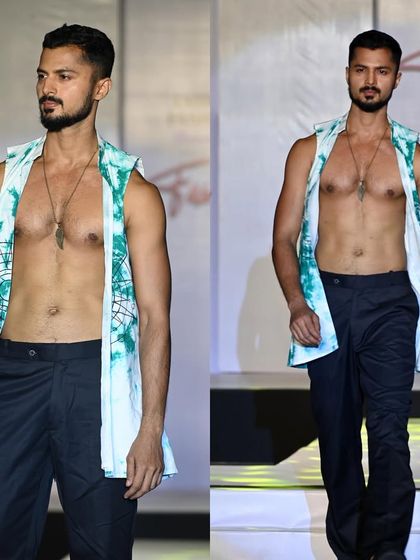 On the ramp for a fashion show. The physique built through years of training provides the canvas for designers' creations.