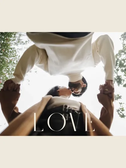 A creative, low-angle shot looking up at the couple, symbolizing the heights their love can reach. This was from a pre-wedding shoot in a historic Delhi location.