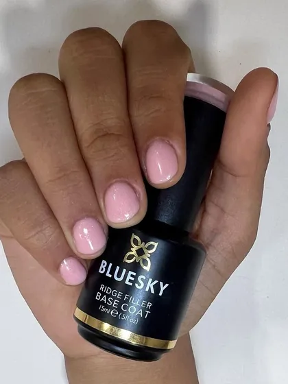 Nail health is my priority. This photo shows the result of my Russian manicure technique on short, natural nails, creating a perfectly clean and tidy base for a flawless application of simple, light pink gel polish.