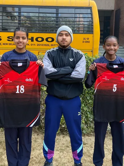 Aayushi and Riya with their Delhi U14 jerseys. Seeing our players represent the state is the biggest reward for a coach.