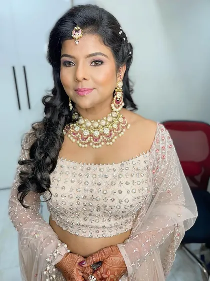 Looking absolutely gorgeous for her 25th Anniversary celebration! I created a timeless look with soft pink tones, glowing skin, and elegant wavy hair.