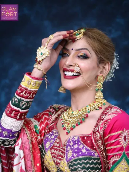 A joyful and expressive shot of our Navratri look. The bright colours of the outfit are complemented by bold makeup and a beautiful smile.