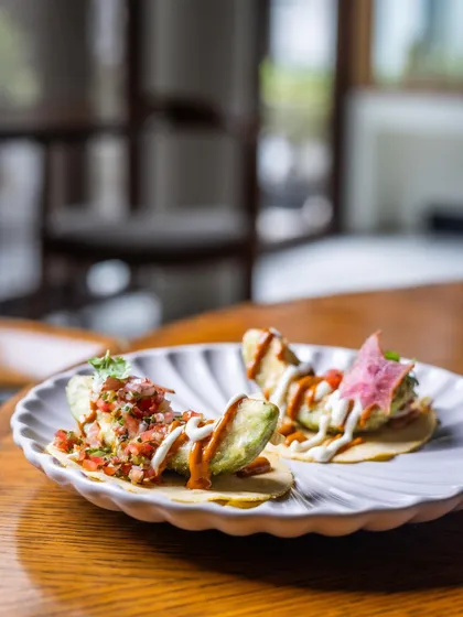 The sensational Avocado Taco, with roasted tomato salsa and pico de gallo on an Ajwain Tortilla, is a small bite with big flavor.