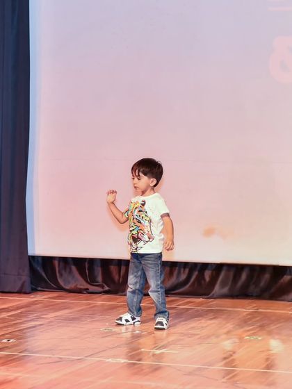 Yuvaan captured in motion during his stage debut, showing his natural rhythm.