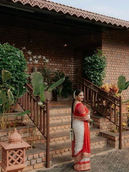 The bride posing at her beautiful wedding venue. The natural, glowing makeup ensures she looks stunning in both indoor and outdoor lighting.