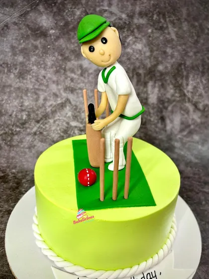 A perfect cake for a cricket enthusiast. This design features a bright green pitch and a handcrafted fondant batsman ready to hit a six.