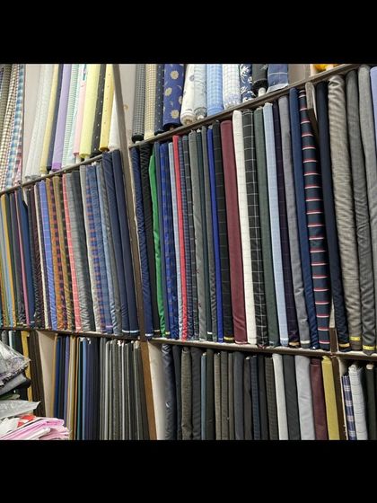 My shop is lined with shelves of premium fabrics. I have materials suitable for business suits, wedding attire, and casual blazers.