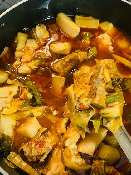 A mixed vegetable curry with pork.