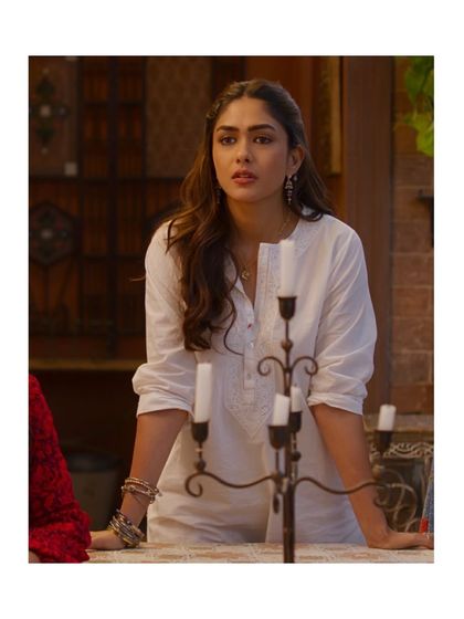 Even in simpler moments, Rabia's style is distinct. Here, she wears a classic white Chikankari Mulmul kurta, elevated with stacks of silver bangles and delicate earrings. This demonstrates how we maintained character consistency even in more understated scenes.