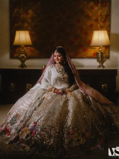 A regal portrait of Diksha in her breathtakingly detailed lehenga. The soft lighting and classic pose give this image a timeless, royal quality, fit for a queen.