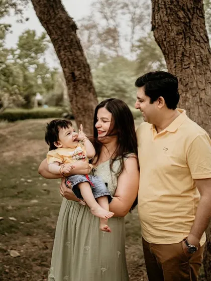I love capturing the unposed, happy moments during an outdoor family session. The genuine laughter and connection between this family in a beautiful park setting is what makes a portrait timeless.