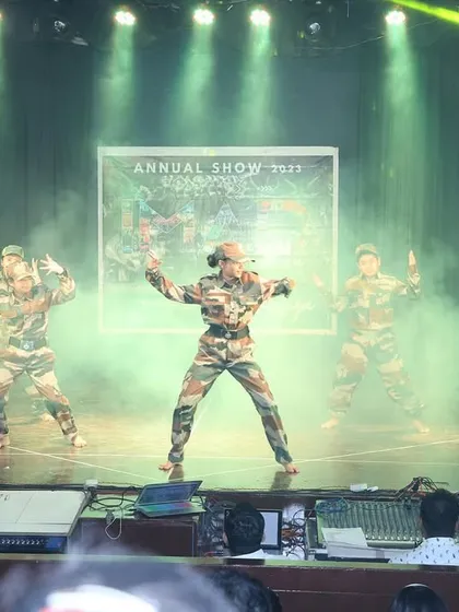 The stage fills with smoke as our 'soldiers' strike a final, powerful pose. We use stage effects to create a memorable and immersive experience for both performers and the audience.