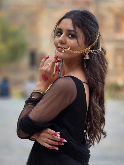 A powerful portrait in a stunning black ethnic outfit. The historic arches of Lodi Garden provided the perfect frame, and her confident pose, combined with the traditional nath (nose ring), created a truly striking and memorable image.