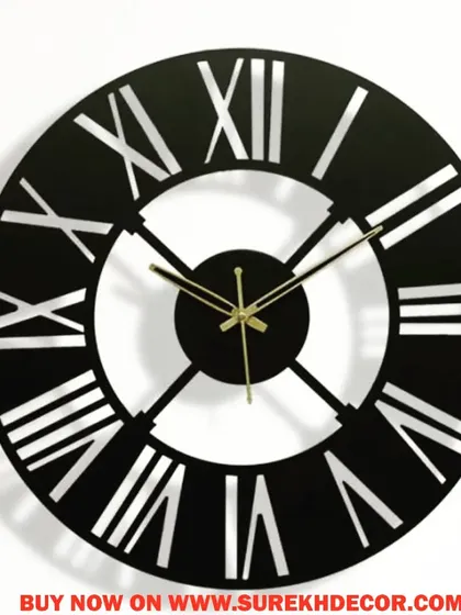 This vintage-inspired wall clock features bold, cutout Roman numerals in a solid black and white design. The high-contrast look is both easy to read and visually striking, making it a great addition to any room.
