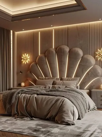 A luxury master bedroom featuring a dramatic, shell-shaped upholstered headboard with integrated lighting, creating a stunning focal point.