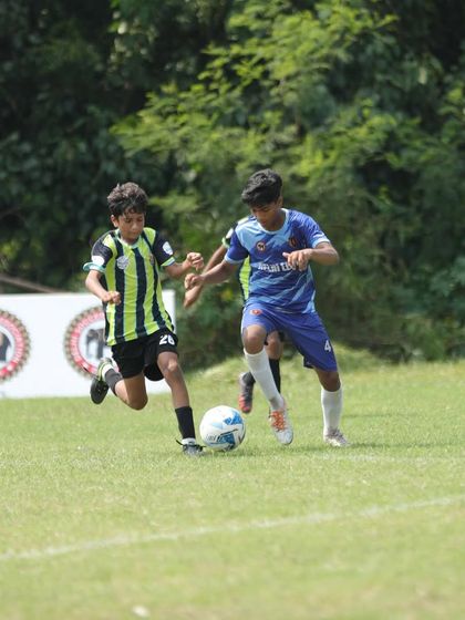 Another shot of Arshad taking on a defender, demonstrating the strength and skill we build in our players for both defensive and offensive roles.
