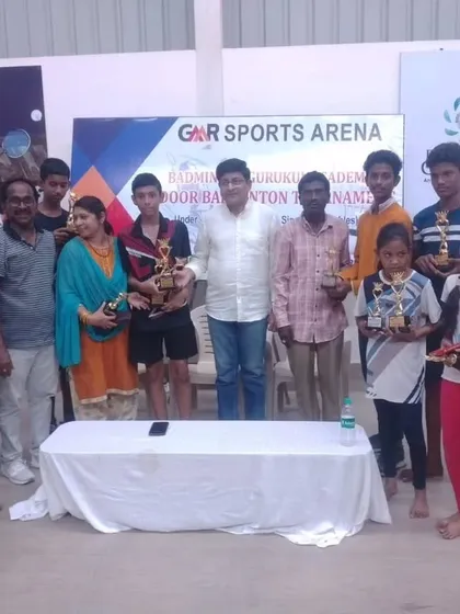 A group photo of all the winners at the GMR Sports Arena tournament. Our events help build a vibrant local badminton community.