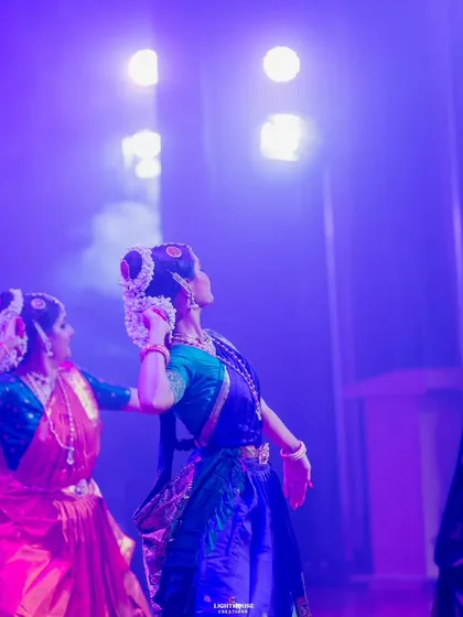 The dramatic lighting of the stage adds to the magic of the performance. Here, my students are captured in a powerful moment during our Margam event.