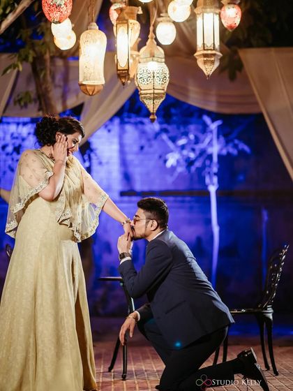 A classic proposal moment. The makeup is glamorous and elegant, making this a truly special and memorable photo.