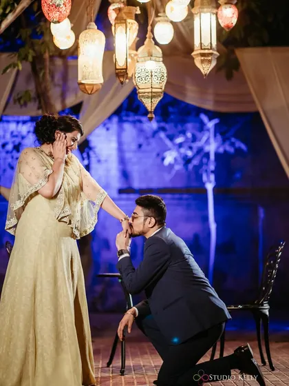 A classic proposal moment. The makeup is glamorous and elegant, making this a truly special and memorable photo.