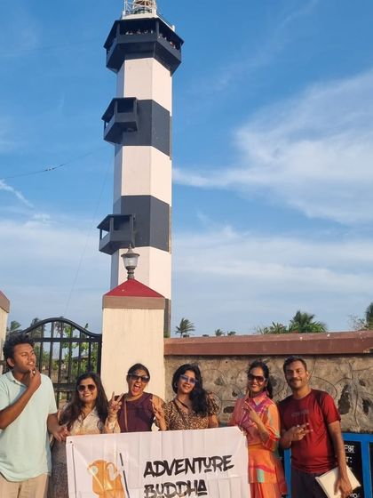 Our group with the banner in front of the old lighthouse in Pondicherry. A great spot to learn about the town's maritime history.