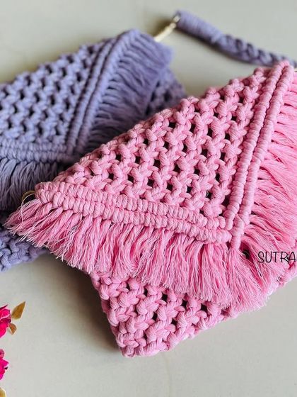 A closer look at the pink and lavender macrame sling bags. You can see the detailed knot work and the soft fringes that give them that perfect boho feel.