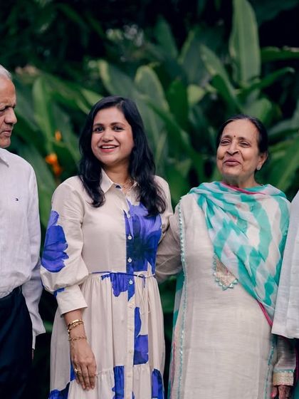 A candid interaction within a multi-generational family portrait, showing the connections and conversations that happen naturally.