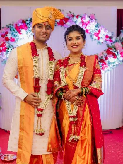 A classic wedding portrait of the beautiful couple against the stage backdrop.