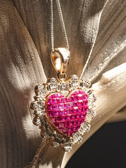 A heart of pure passion. This ruby and diamond heart pendant is a classic symbol of love, crafted with exceptional stones to create a gift that will be treasured for a lifetime.