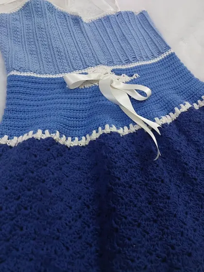 Another detailed shot of the Aviva Dress, showing the beautiful textures and the side ribbon tie.