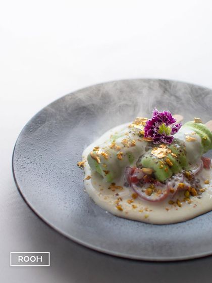 Our Chia and Kiwi Kulfi Falooda, with a touch of drama from dry ice. Garnished with edible gold leaf, it’s a light, fruity, and visually stunning end to a meal.