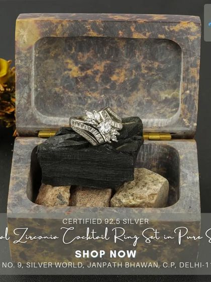 This modern floral cocktail ring is set with marquise and baguette-cut zirconia stones, creating a dynamic and sparkling effect. It's a perfect accessory for a glamorous evening.