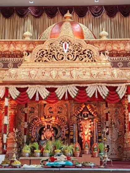 Another perspective of the grand temple-style mantap, highlighting its intricate carvings and majestic presence. This decor is designed to make your wedding feel like a divine celebration.