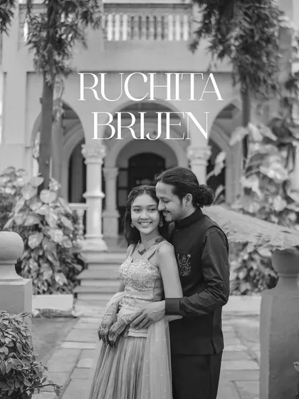 A timeless black and white portrait of the couple in a loving embrace. The heritage architecture in the background adds a sense of history and permanence to their pre-wedding photo.