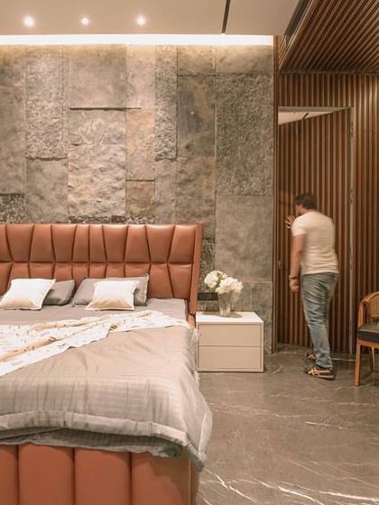 The hidden door in action. This image shows how the fluted panel opens to reveal a passage, maintaining the clean aesthetic of the bedroom when closed.