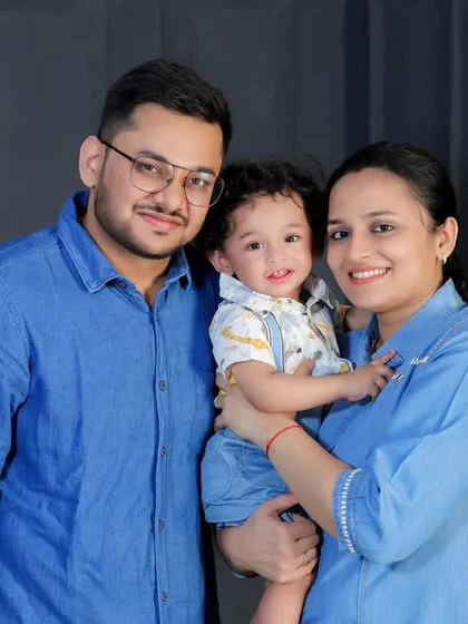 A lovely family portrait with coordinated blue outfits. A simple color scheme can create a very polished and cohesive look for studio photos.