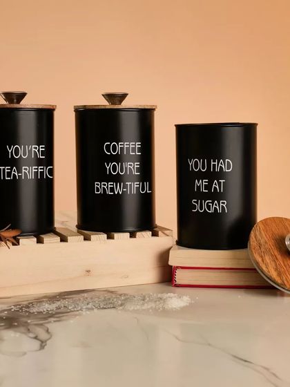 A set of black kitchen canisters styled in a similar setup. I can shoot product variations in different colors to maintain a consistent look for your brand.