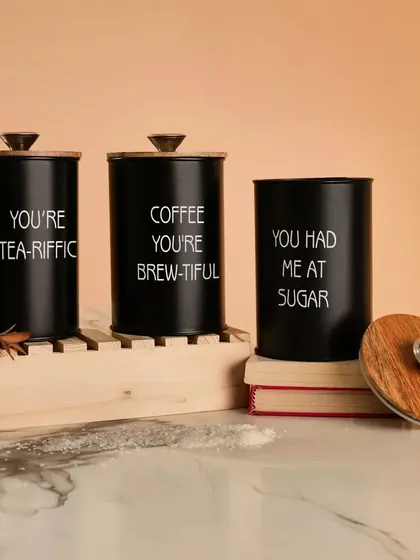 A set of black kitchen canisters styled in a similar setup. I can shoot product variations in different colors to maintain a consistent look for your brand.